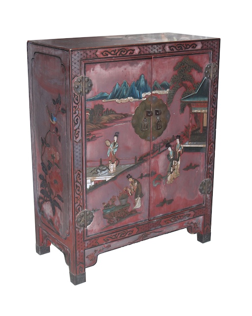 A 20th century Chinese red laquer cabinet with figures in the garden decoration on front door panels