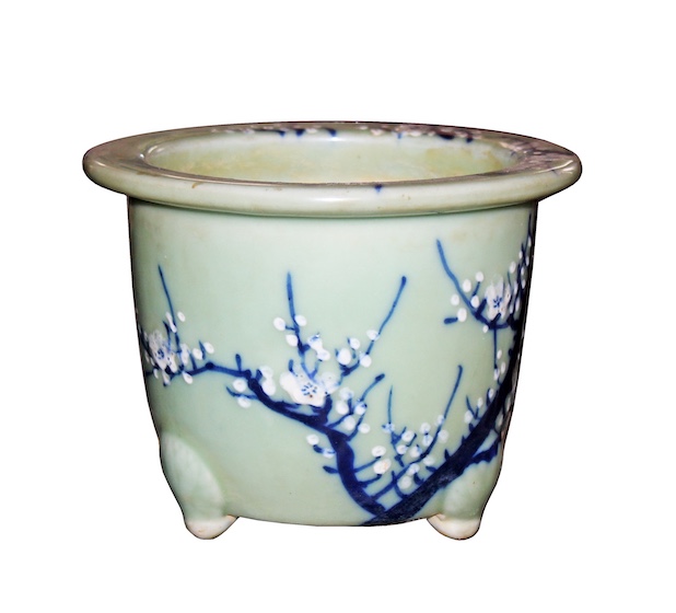 A 19th early 20th century Seto Imari celadon pot with plum blossom