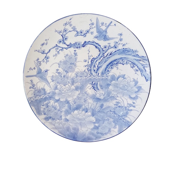 A 19th century Japanese large Arita blue and white dish painted with birds and flowers