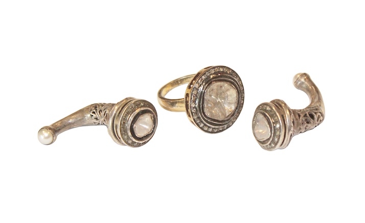 A set of three modern silver jewelry consisting of two earings and one ring with rose cut diamonds