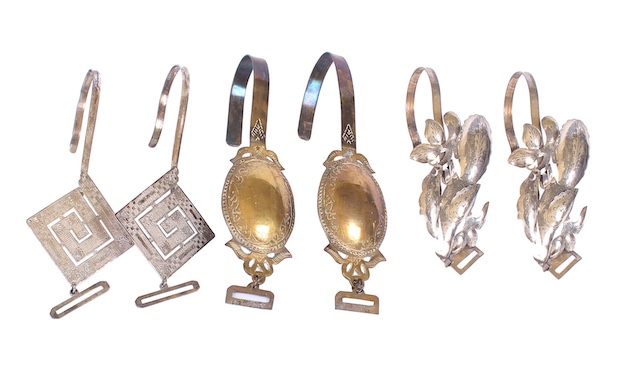 A set of six first half 20th century of silver curtain hooks