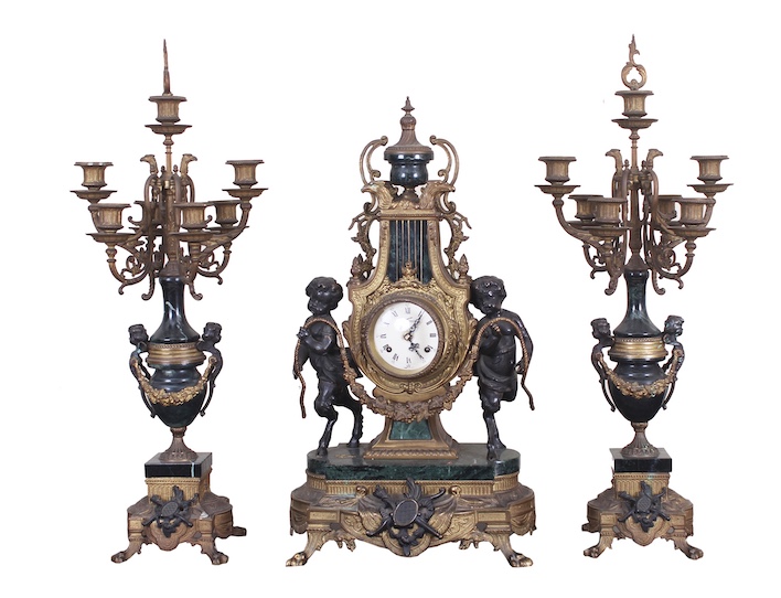 A set of three pieces brass mantel clock with pair of candelabra