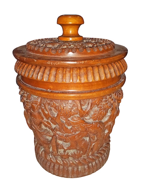 A carved wooden bowl with cover