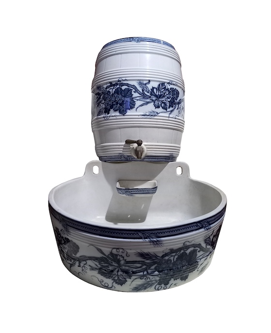 A late of 19th century European antique ceramic blue and white basin and water dispenser