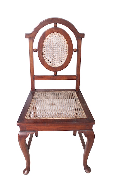 Four pieces of carved teak chairs with rattan seat and back