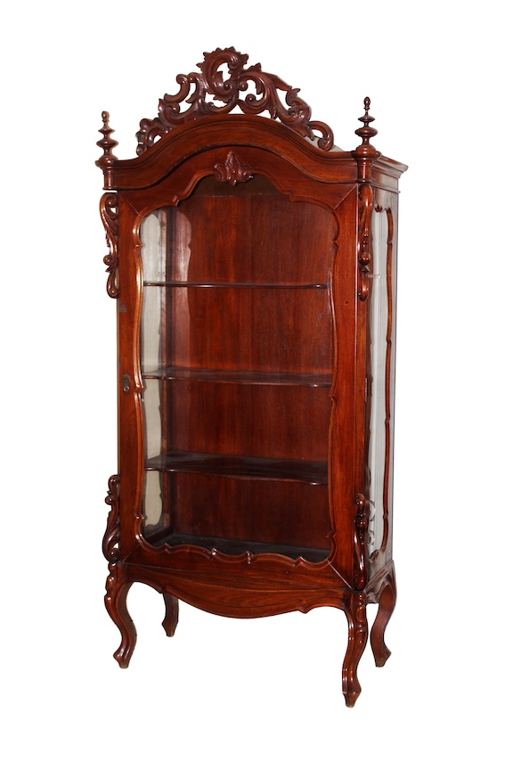 A 20th century carved teak display cabinet