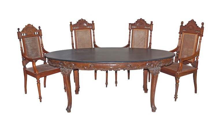 A set of living room furniture consisting of  four armchairs and oval table with marble top