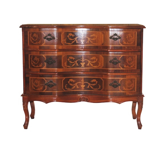 A wooden commode with three drawers