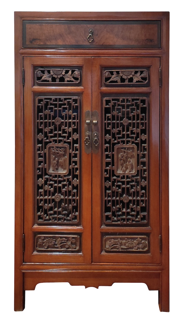 A Chinese carved wood cupboard with reticulated doors