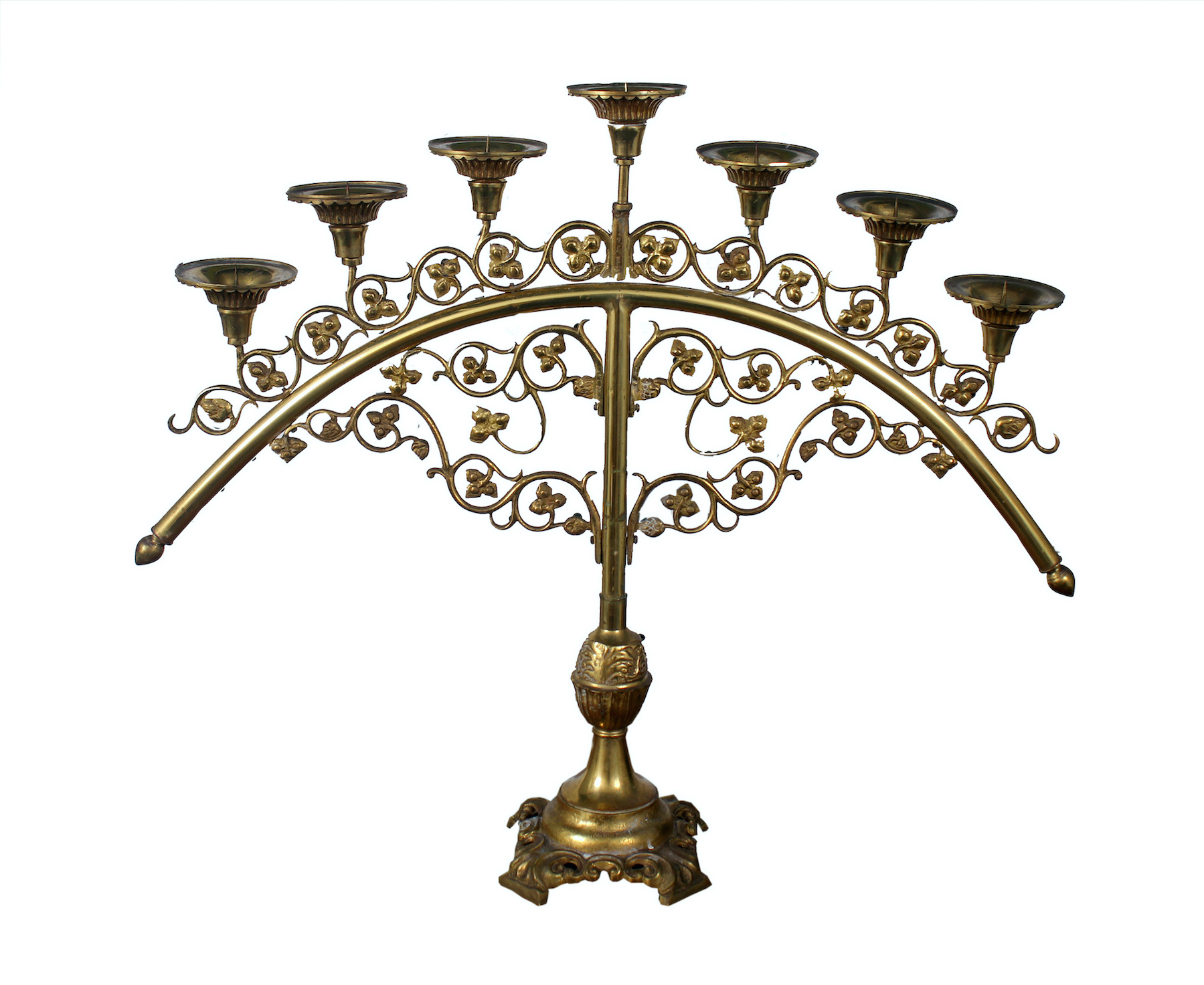 A semi-circle shape brass candle holder with seven branches