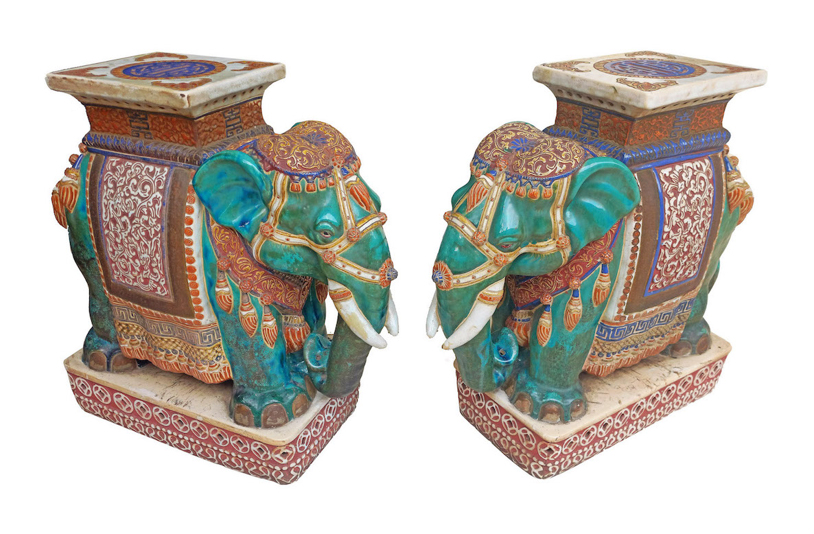A pair of Vietnamese polychrome vintage ceramics and stands in the form of elephant
