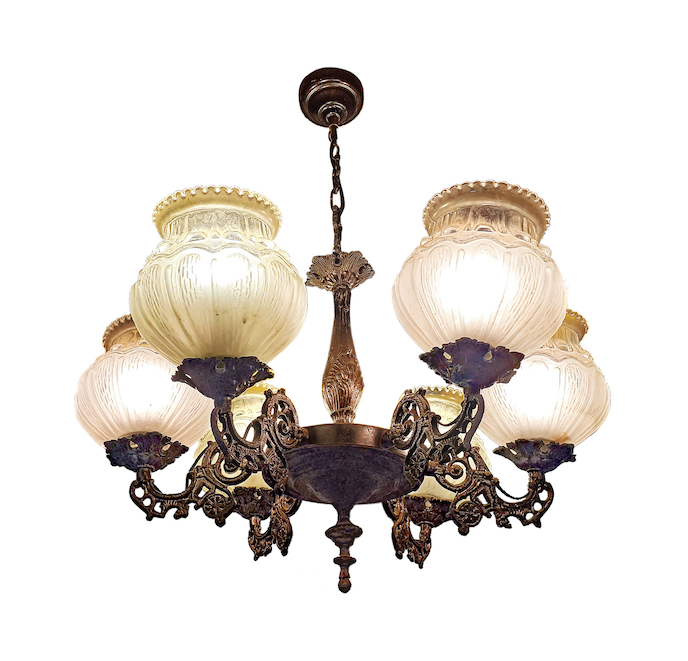 A brass hanging lamp with six arms and glass shades