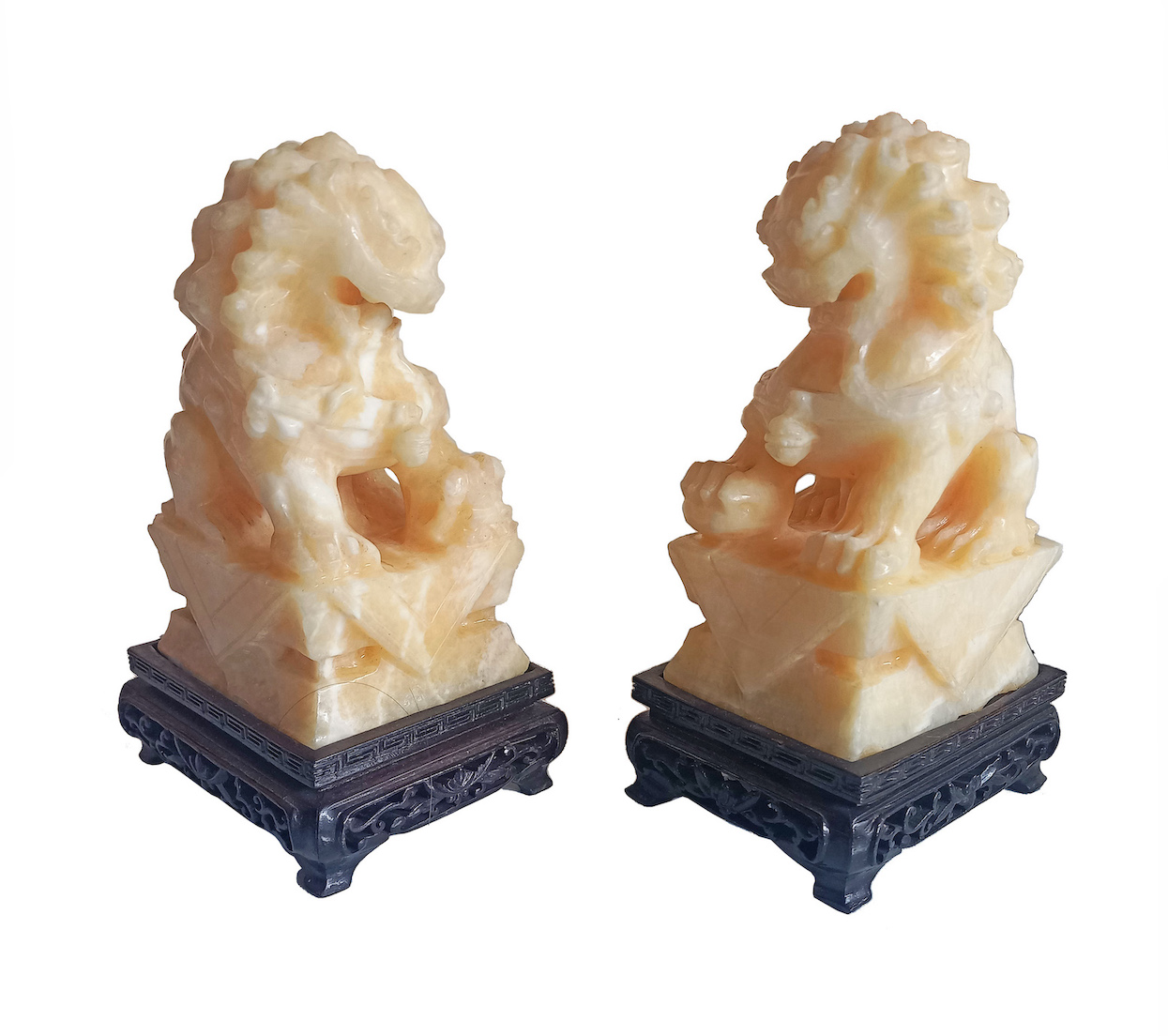 A pair of Chinese carved soapstone guardian lions