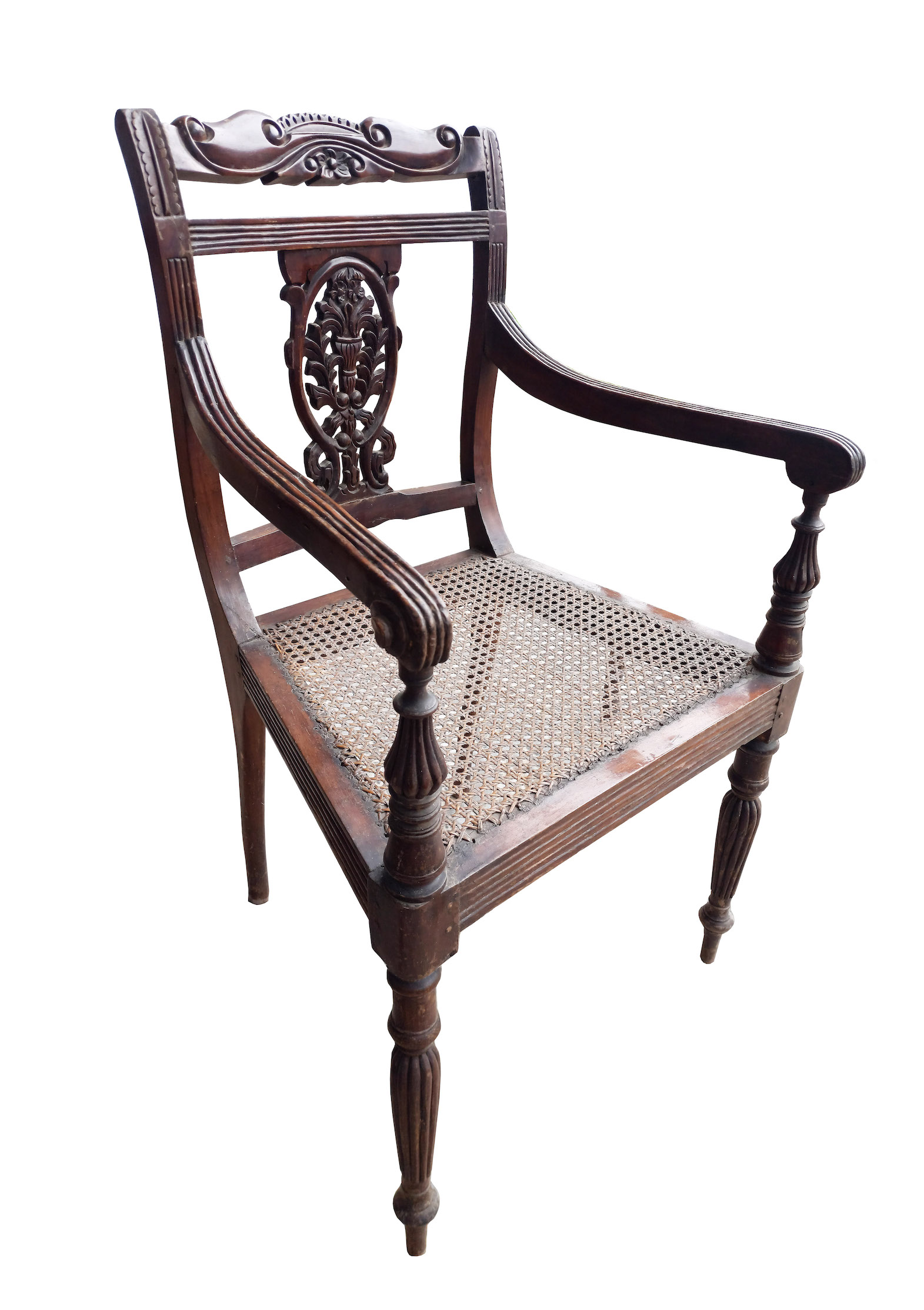 A set of three carved teak arm chairs with rattan seat