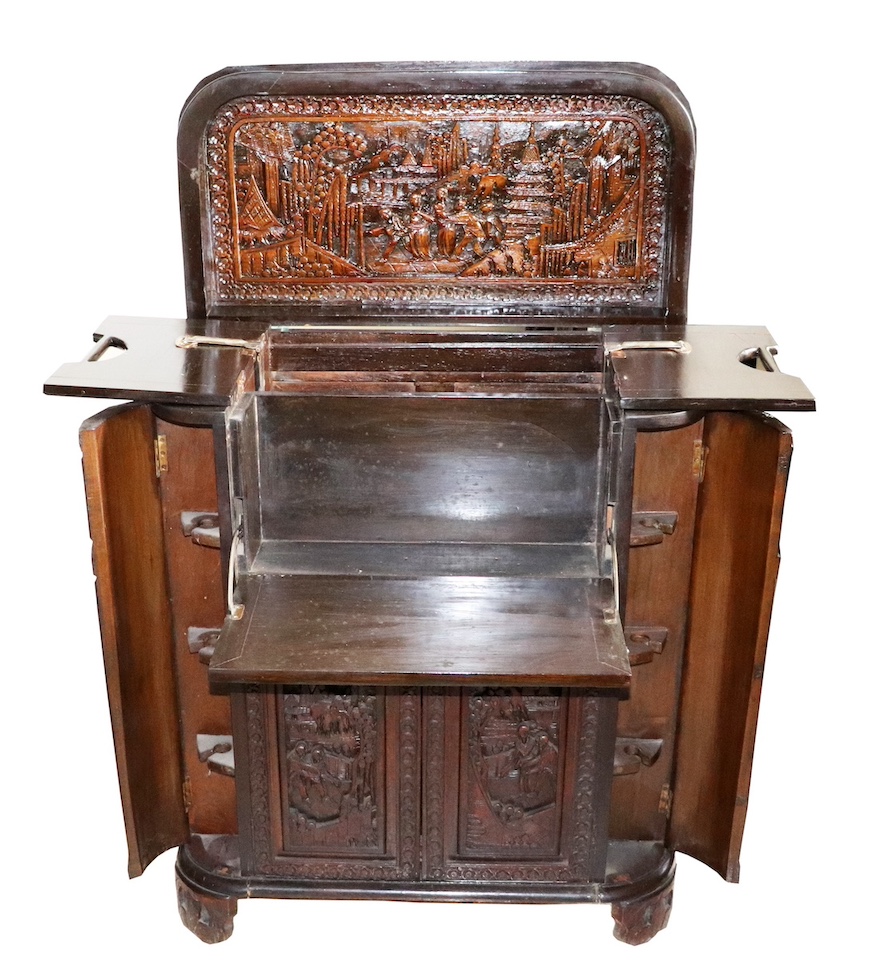 A 20th century vintage carved bar cabinet