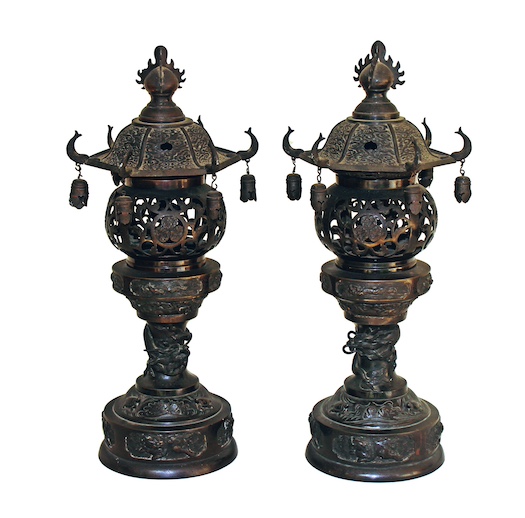 A pair of 19th - 20th century Japanese bronze candle holder with reticulated decoration