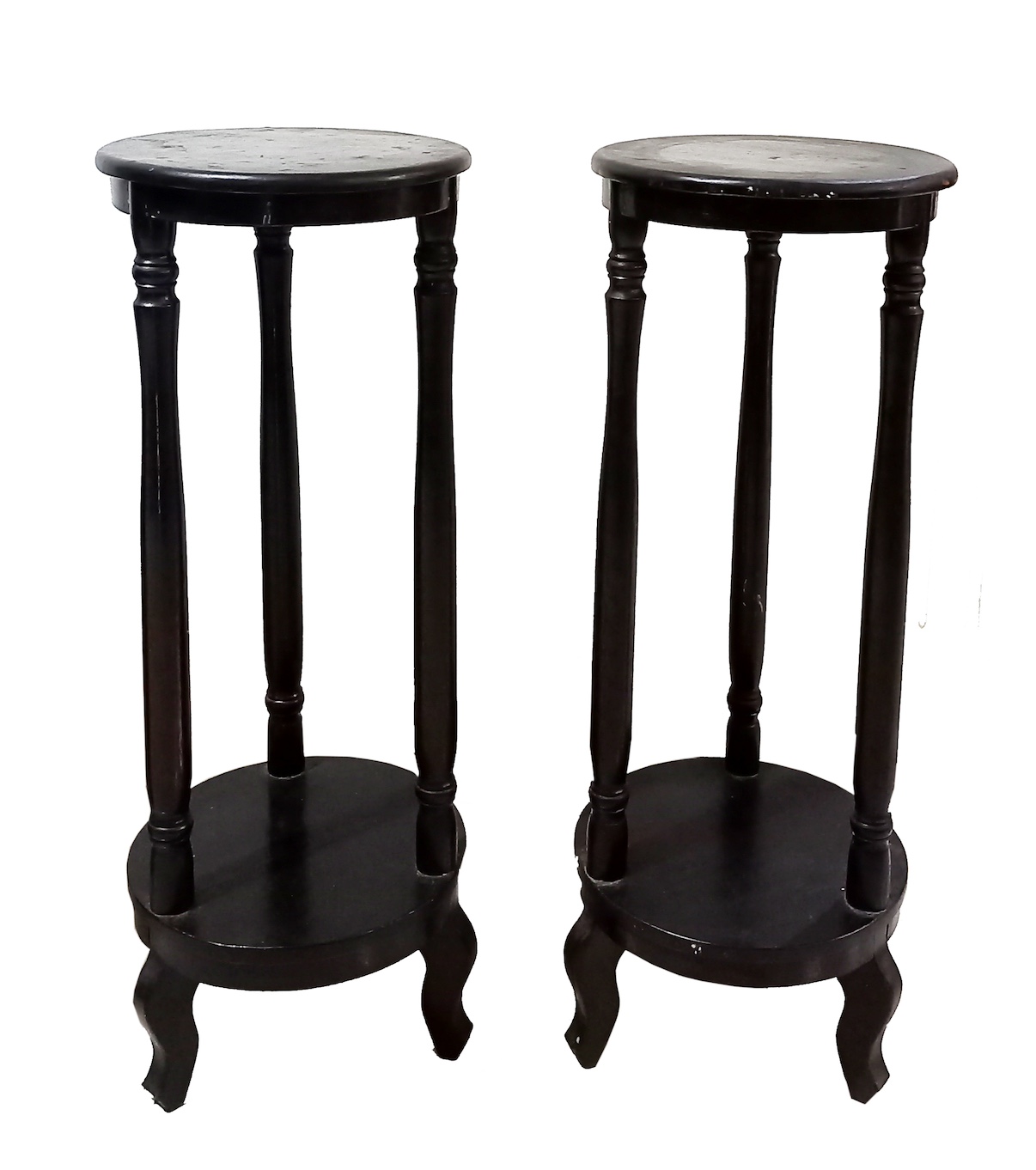 A pair of carved wood stand