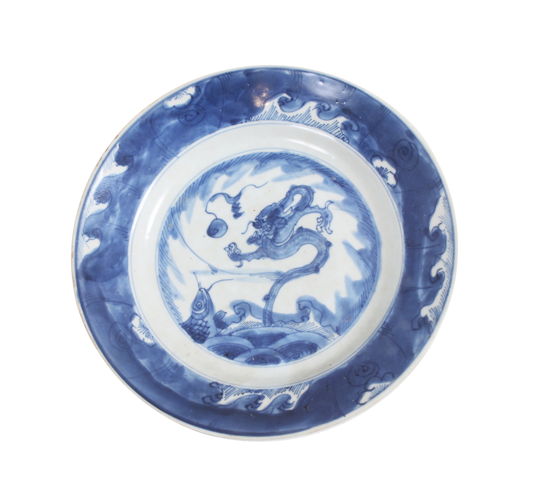 An early Qing 17th - 18th century blue and white dragon plate