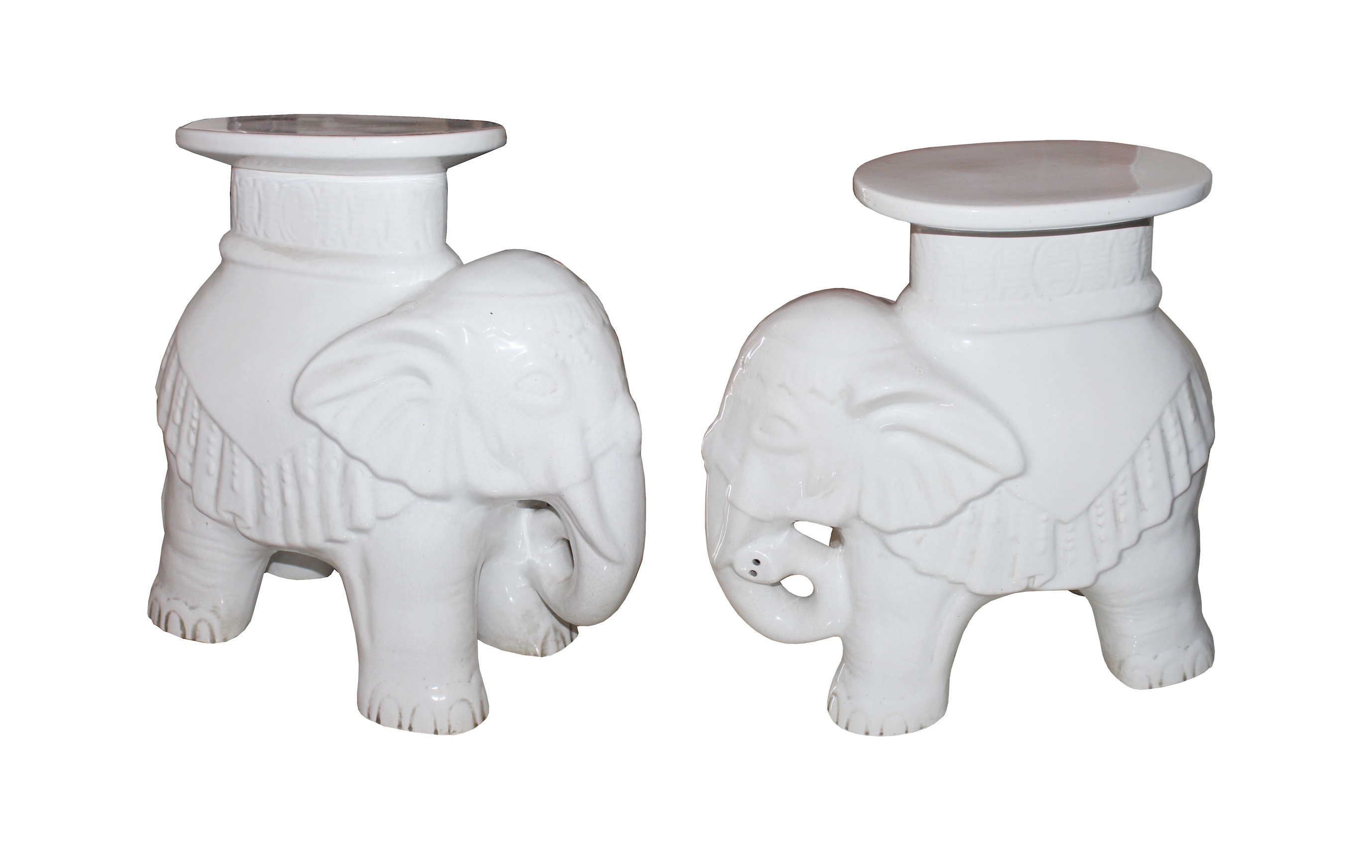 A pair of white glazed ceramic stands model of standing elephants