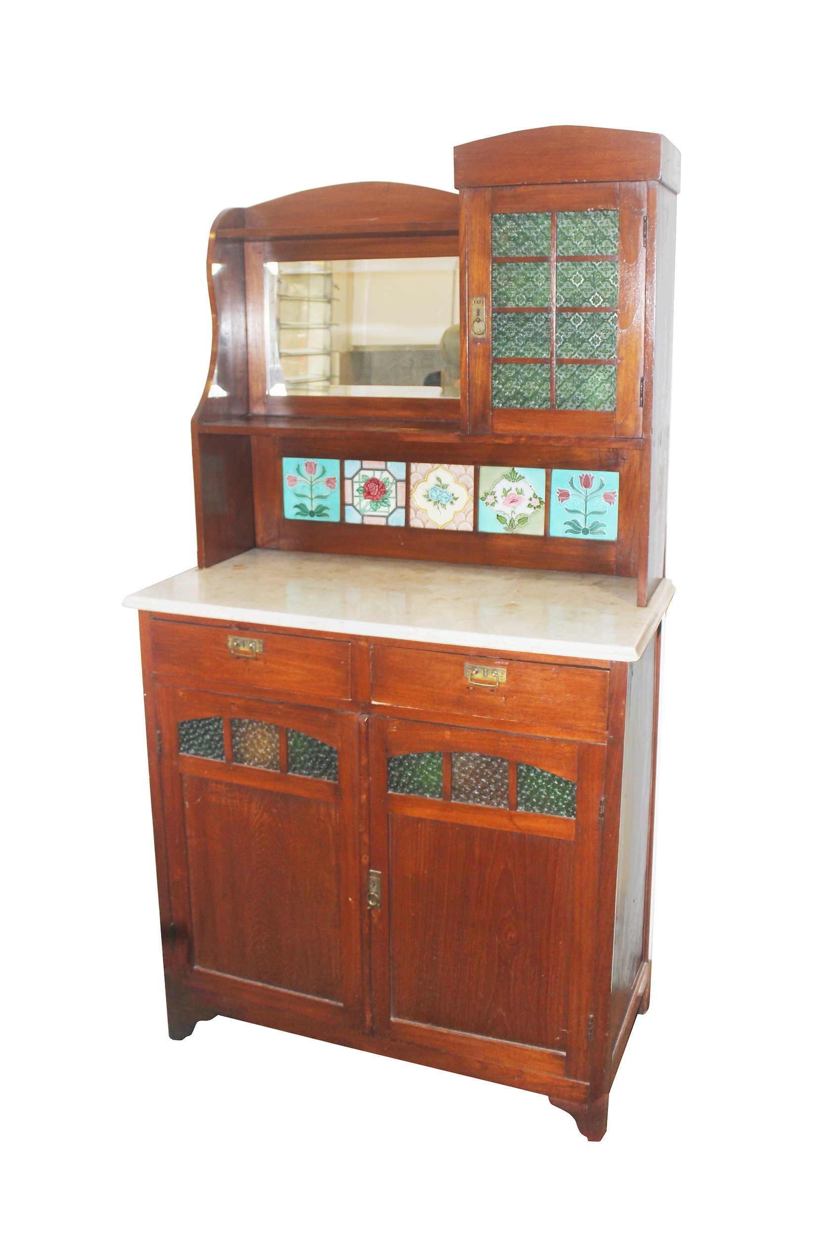 A first half 20th century Dutch colonial period carved teak side board with polychrome tiles and marble top
