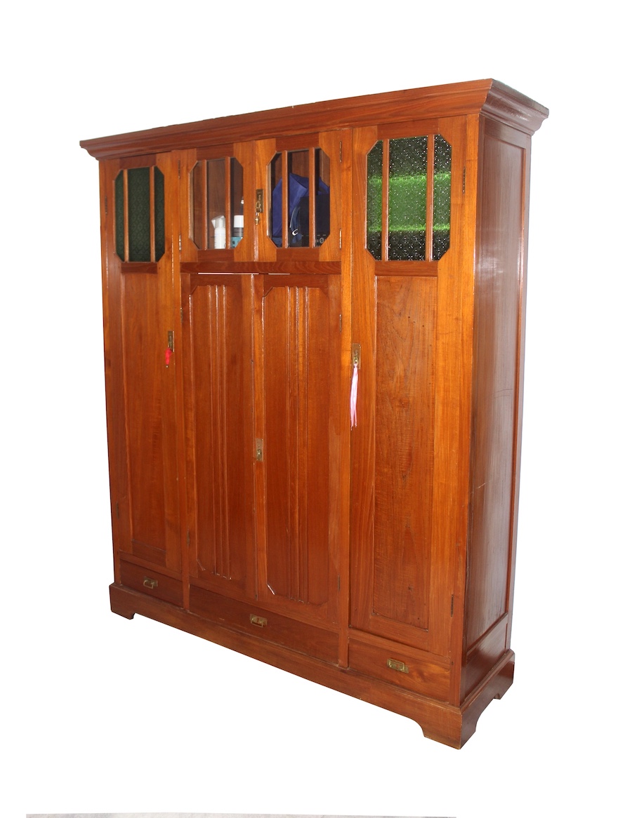 An early 20th century carved teak wardrobe