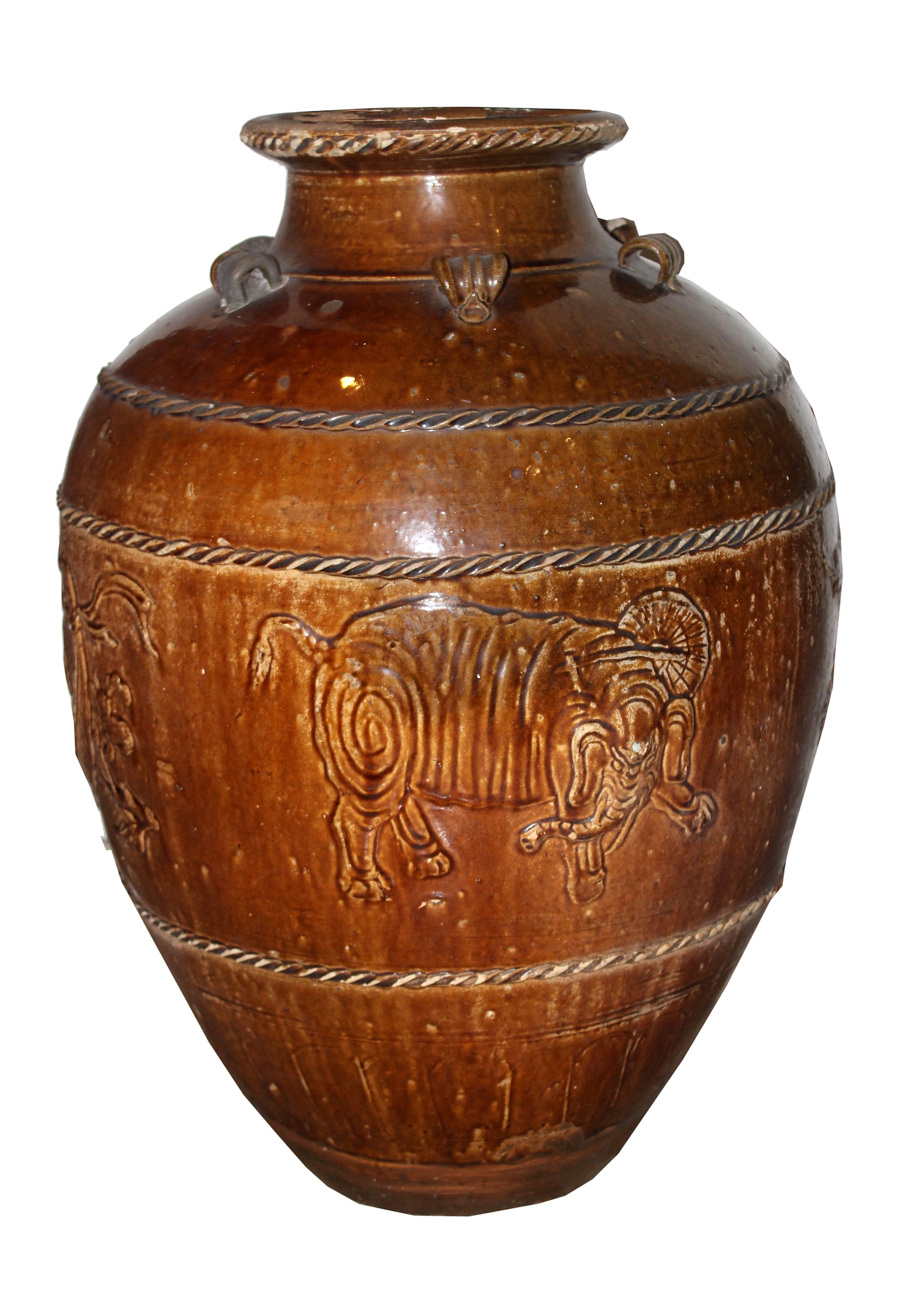 A qing dynasty Chinese stoneware brown glazed storage jar with relief of elephant