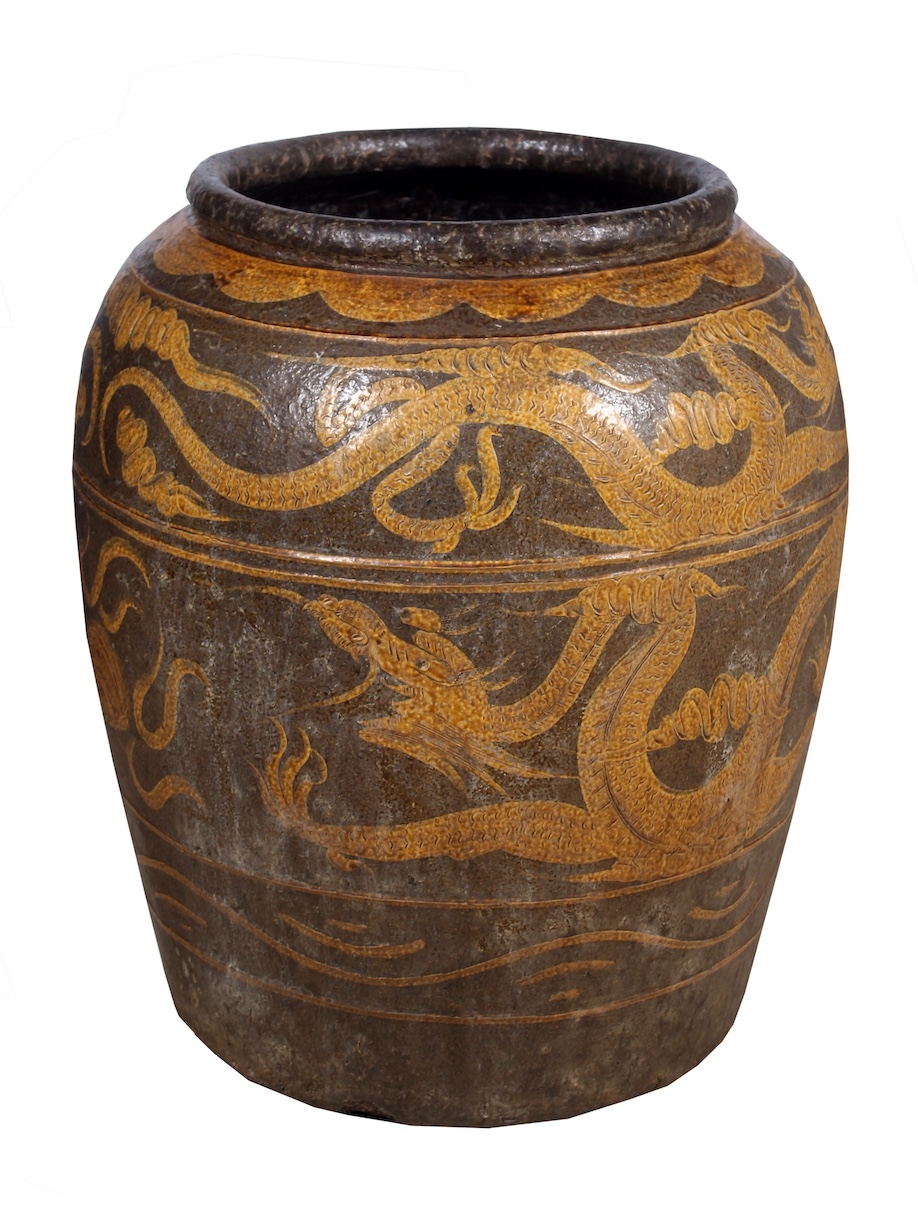A 19th early 20th century Chinese stoneware storage jar decorated with dragons in yellow ochre