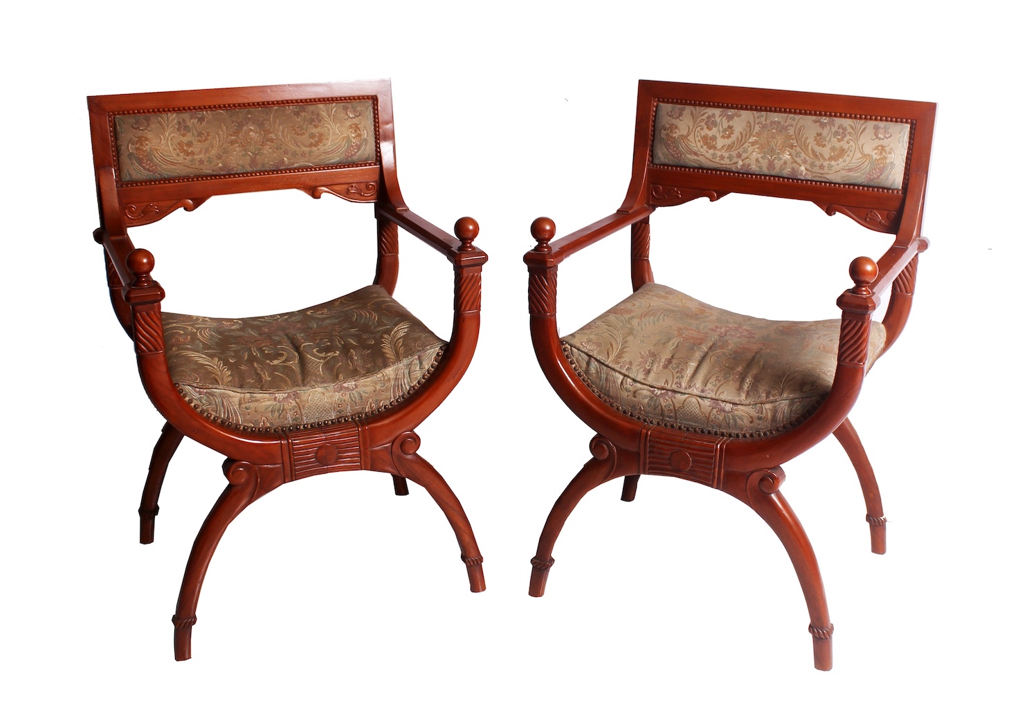 A pair of 20th century carved teak armchairs with velvet back and seat