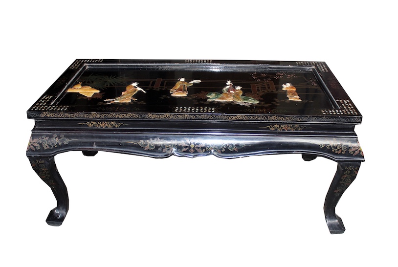 A Chinese style laquared low table decorated with figures in the garden