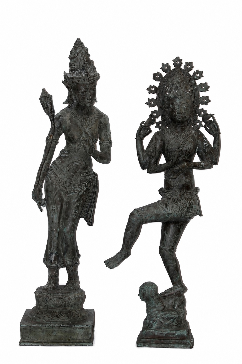 Two bronze statues of Shiva, one standing over a kneeling boy, and the other depicting Shiva as a dancer.