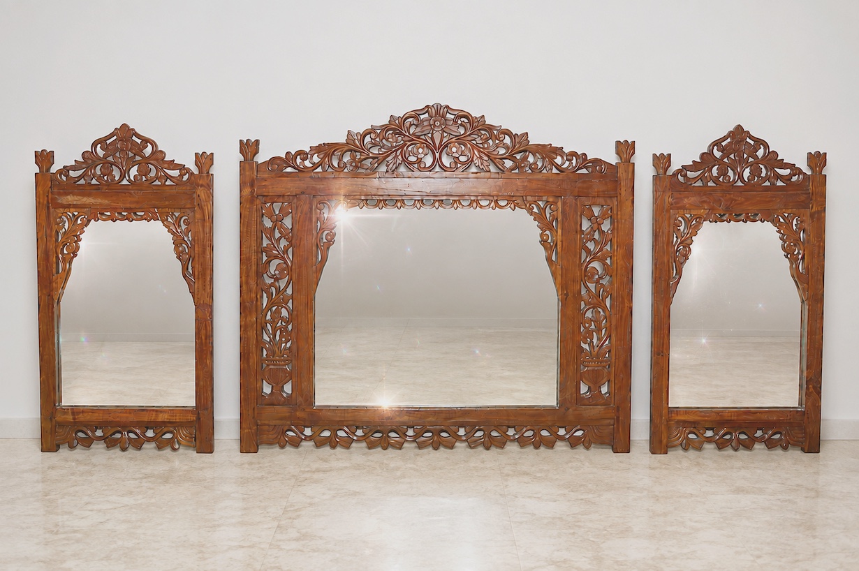 A set of three of 20th century carved teak wall mirror
