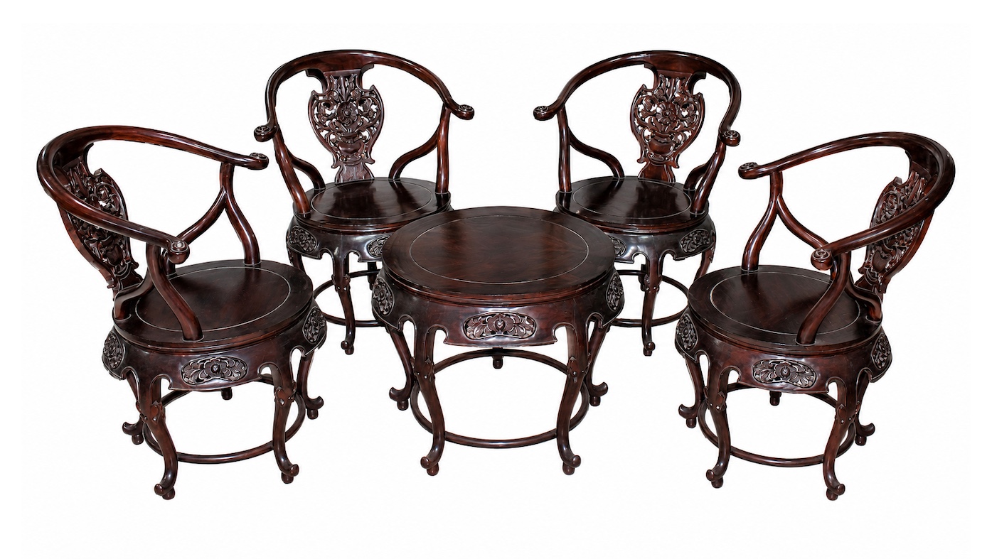 A set of carved indonesian rosewood small table and four arm chairs