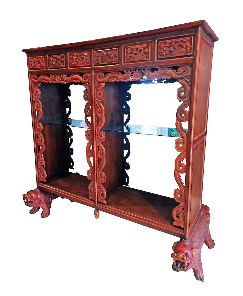 A modern carved teak display cabinet