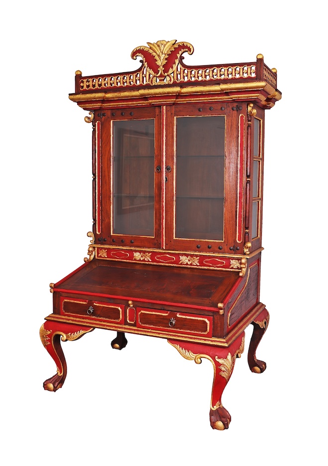 A Dutch colonial period cabinet on stand with gilt decoration