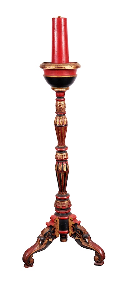 A pair of carved gilt teak wood tripod candle stand