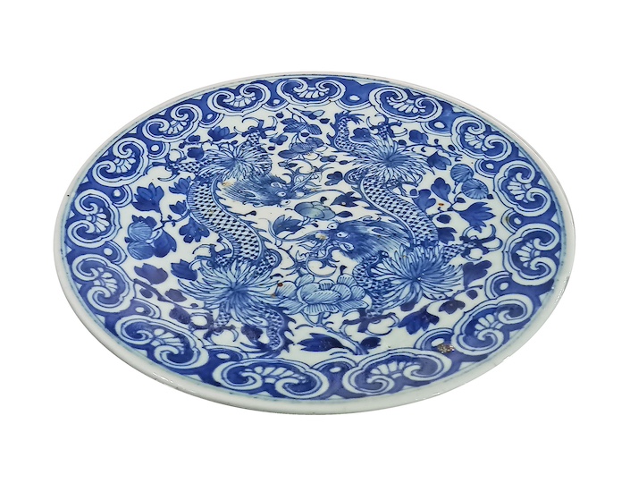 A 19th century Late Qing blue and white dish painted with dragon among flowers