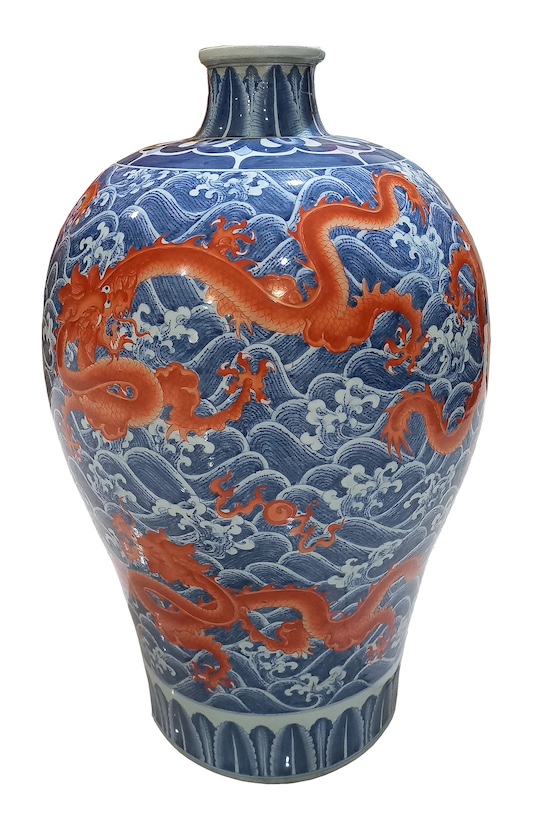 A modern Chinese meiping painted with red dragons on blue wave ground